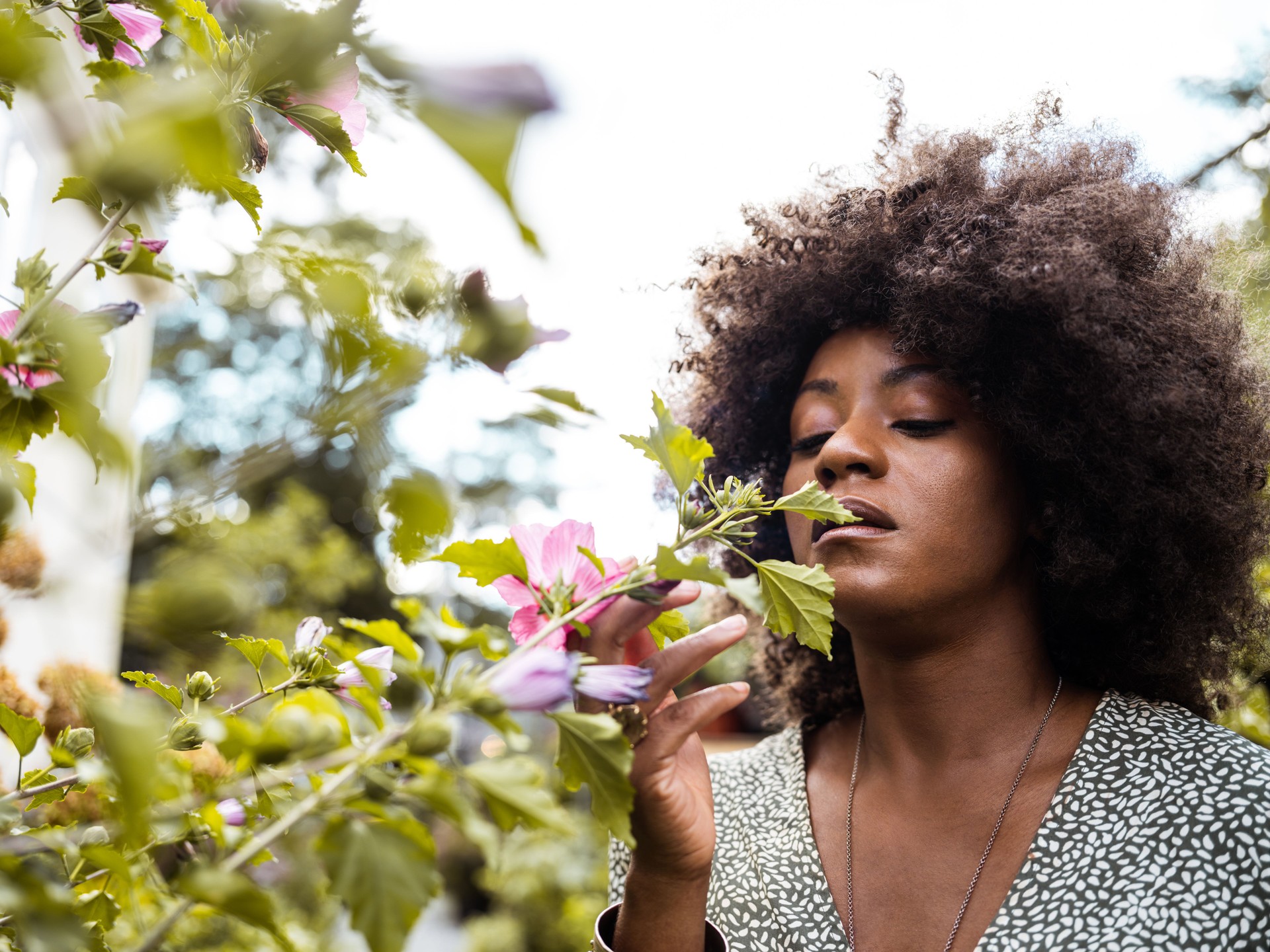 Black woman at the flower shop garden